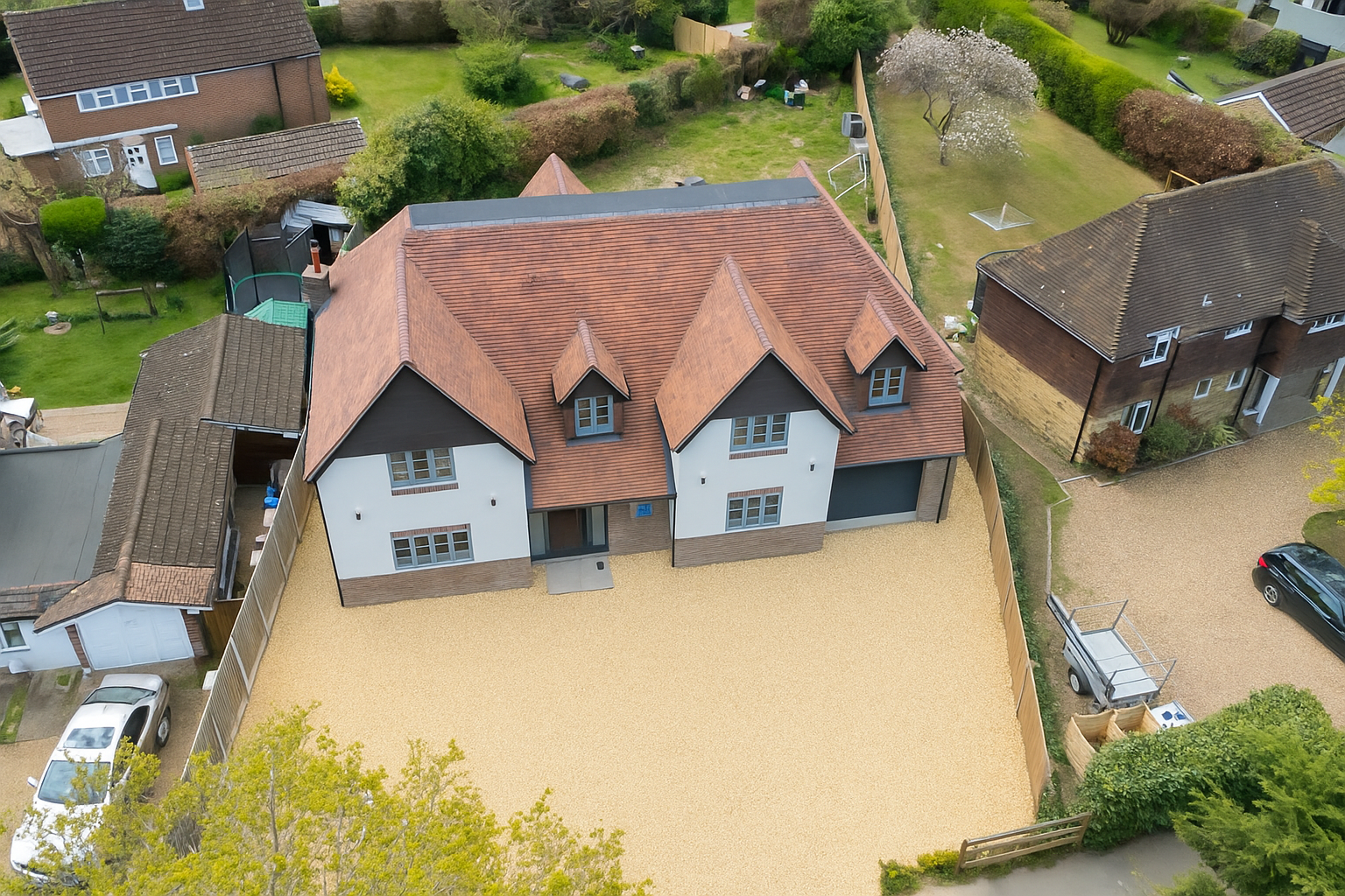 Aerial view of the new build home and surrounding site